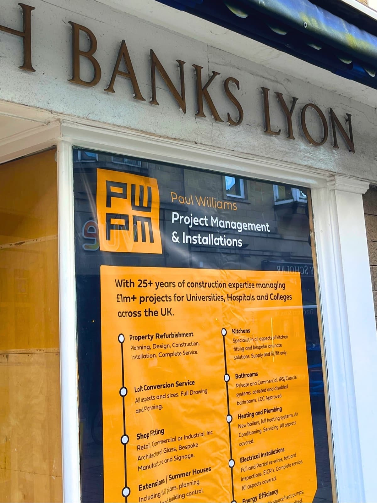 PWPM site signage in the window of Banks Lyon jewellers, Lancaster